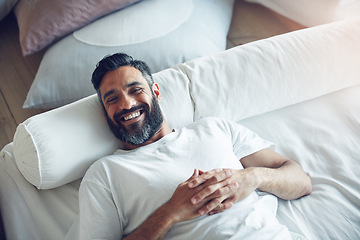 Image showing Top view, portrait and man on his bed, relax and smile on a break, chilling and cheerful at home. Face, male person and happy guy in his bedroom, resting and wellness with joy, happiness and morning