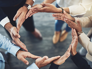 Image showing Collaboration, diversity and business people with their hands together in a circle for unity. Teamwork, friends and top view of multiracial employees with connection for team building in the office.