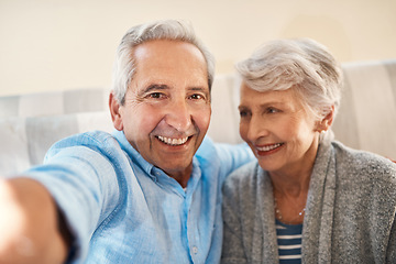 Image showing Senior couple, happy selfie and couch in retirement home for social media, blog post and internet. Elderly man, woman and photography for profile picture on app, web or smile together on lounge sofa