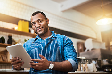 Image showing Smile, tablet and portrait of man in cafe for online, entrepreneurship and startup. Retail, technology and food industry with small business owner in restaurant for barista, store and coffee shop