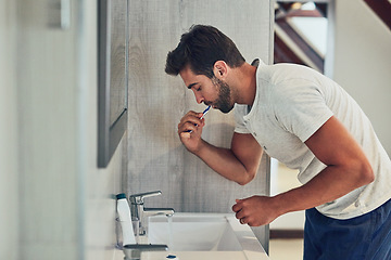 Image showing Dental, sink and brushing teeth with man in bathroom for cleaning, morning routine or oral hygiene. Smile, cosmetics and health with male person and toothbrush at home for self care, breath or mouth