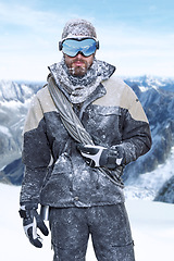 Image showing Nature, portrait and man in snow with climbing gear during winter, cold and extreme weather background. Male person mountaineering and covered in snowfall for environment holiday or travel vacation