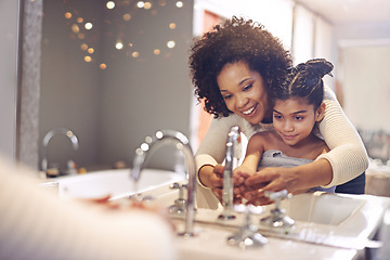 Image showing Water, cleaning and washing hands by mother and child in a bathroom for learning, hygiene and care. Basin, wash and hand protection by mom and girl together for prevention of bacteria, dirt and germs