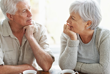 Image showing Senior couple, talking and drinking tea in home for conversation, communication and quality time together. Old man, elderly woman and chat with cup of coffee for break, retirement and romantic love