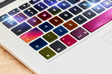 Image showing Laptop keyboard, color and technology for work, business and internet on a table. Digital, creative and pc computer for electronic entertainment, gaming or web on a desk for streaming and creativity