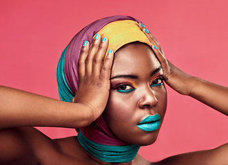 Image showing Makeup, beauty and scarf with portrait of black woman in studio for creative, art and culture. Fashion, cosmetics and natural with face of model isolated on pink background for african and color