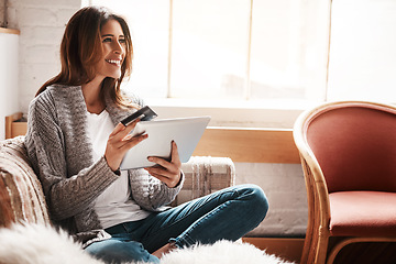 Image showing Thinking, tablet and credit card with a woman online shopping on a sofa in the living room of her home. Ecommerce, finance and fintech banking with a young female online customer in her house