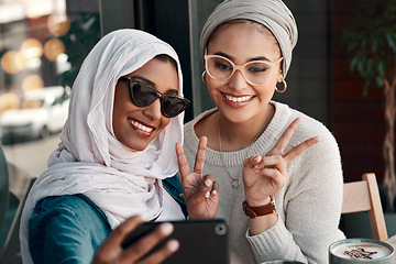 Image showing Selfie, muslim women and friends with peace sign in city for social media, influencer content creation or fashion blog. Happy gen z people in Saudi Arabia, emoji profile picture or online photography