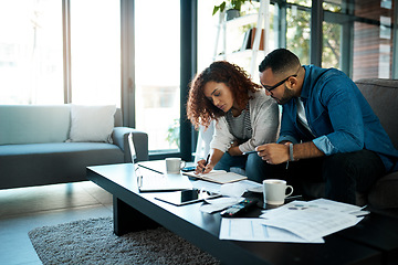 Image showing Couple working on budget, finance and bills with notes on payment for loan, mortgage and debt while at home. Financial review of spending, income and savings with man and woman writing in notebook