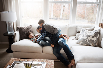 Image showing Father, boy kids and playing on couch, fun and carefree with love, energy and happy at family home. Man play with children in living room, crazy and playful with happiness and excited with laughter