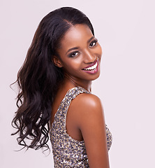 Image showing Portrait, beauty and African woman posing for skincare, cosmetics or hair salon style, makeup and prom fashion in studio. Girl model, smile and looking over the shoulder on white background