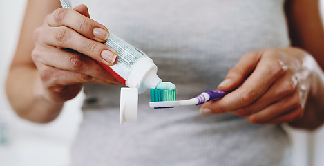 Image showing Hands, toothpaste and woman toothbrush to clean teeth for hygiene, care and dental wellness in morning routine. Person, dentistry and cosmetic healthcare or mouth cleaning, whitening and selfcare