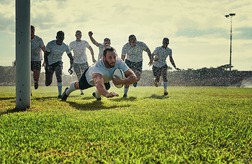 Image showing Sports, men rugby team on green field and playing with a ball. Teammates with fitness or activity outdoors, collaboration or teamwork and happy or excited people celebrate a player score a try