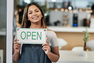 Image showing Happy woman, open sign and portrait of cafe owner, small business or waitress for morning or ready to serve. Female person or restaurant server holding board for coffee shop or cafeteria opening