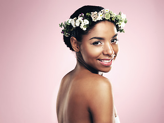 Image showing Portrait of happy woman, flowers and crown in studio, pink background and aesthetic of natural beauty, mockup and glow. Face of african model, skincare and floral hair wreath for eco friendly makeup