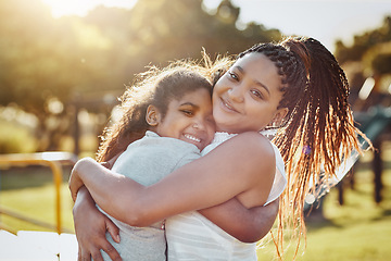 Image showing Woman hug young girl outdoor, smile in portrait and love, bonding in park with happiness and care. Relationship, mother and daughter spending quality time together with embrace, affection and family