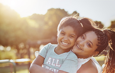 Image showing Woman, young girl outdoor with smile in portrait and love, bonding in park with happiness and care. Relationship, mother and daughter spending quality time together with embrace, affection and family