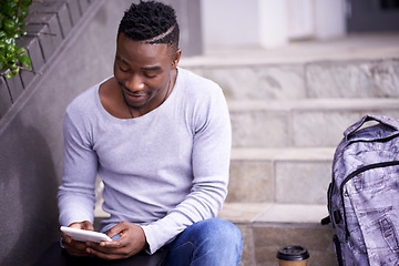 Image showing Relax, college and tablet with black man on stairs for learning, education or research. School, social media and technology with male student on steps of university campus for app, digital or study