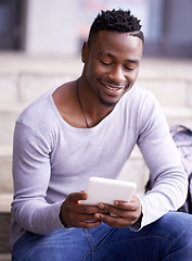 Image showing Happy, college and tablet with student on stairs for learning, education or research. Smile, social media and technology with male black man on steps of university campus for app, digital or study