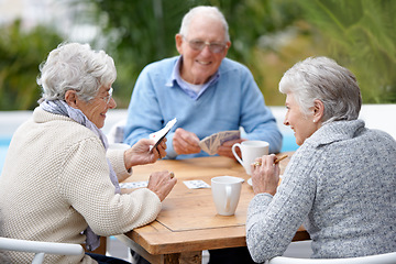 Image showing Poker, smile and senior group with retirement, outdoor and cheerful together with joy, relax and playful. Elderly people, old man and mature women outside, card games and chilling with social bonding