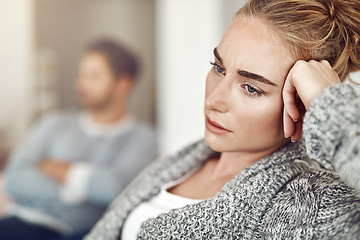 Image showing Upset, depression and woman in argument with her boyfriend in the living room of their apartment. Sad, disappointed and moody female person with conflict, fight or breakup with partner at their home.