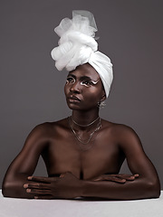 Image showing Beauty, fashion and black woman with makeup, thinking and confident against a grey studio background. Female person, girl and model with ideas, fantasy and feminine with fierce attitude and culture