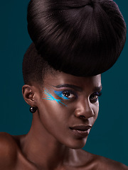 Image showing Portrait, hair and cosmetics with a model black woman in studio on a blue background for beauty. Face, haircare and makeup with an attractive young female person at the salon for fashion or styling