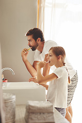 Image showing Brushing teeth, dad and young child in a bathroom at home in morning with dental cleaning. Oral hygiene, kids and father together in a house with bonding and parent love for children with toothbrush