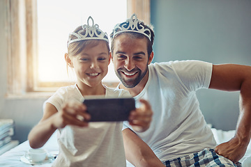 Image showing Man, young girl and selfie in princess tiara, happiness with love and care at family home. Smile in picture, father and daughter bonding with crown, happy people spending time together in bedroom