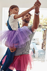 Image showing Father with daughter dancing in tutu, playful and fun at home with bonding with love and care Family, man and girl dance in living room, carefree and spending time together with relationship and joy