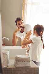 Image showing Brushing teeth, father and child learn in a bathroom at home in morning with dental cleaning. Oral hygiene, kids and dad together in a house with bonding and parent love for children with toothbrush