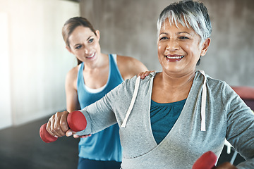 Image showing Physical therapy, dumbbell and fitness with old woman and personal trainer for support, health and physiotherapy. Training, weightlifting and coaching with senior patient and female trainer for help