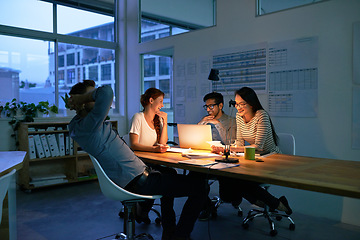 Image showing Collaboration, night and a business team working in the boardroom for planning, strategy or innovation. Meeting, teamwork and overtime with a group of employees at work on a laptop in the evening