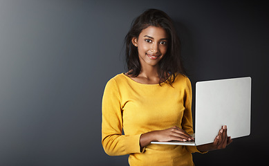 Image showing Woman, student and portrait with a laptop for university and school work with mockup. Isolated, gray background and education work of a young Indian female person with smile and computer for college