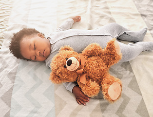 Image showing Sleeping, teddy bear and nap with baby in bedroom for tired, development and innocence. Dreaming, relax and comfortable with african infant and toy at home for morning, resting and bedtime