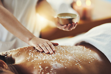 Image showing Woman, hands and relax in salt scrub for skincare, exfoliation or relaxation at indoor beauty spa. Hand of masseuse rubbing salts on female back for physical therapy, massage or treatment at resort