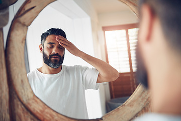 Image showing Stress, headache and man by a mirror in the bathroom while doing a skincare routine in his home. Migraine, tired and mature male person doing a health dermatology face treatment in his modern house.