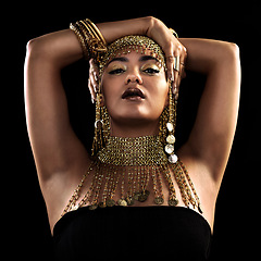 Image showing Fashion, portrait and woman in studio with gold, beauty and royal, jewellery or attitude on black background. Face, queen and lady model pose in luxury accessory for cosplay, rich or aesthetic makeup