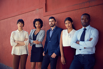 Image showing Portrait, business people and diversity of serious team, professional commitment and collaboration against a red wall. Focused group of confident employees with corporate pride, trust and solidarity