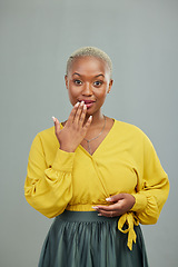 Image showing Black woman, hand and mouth for surprise in studio portrait for secret, mistake or wow by background. African model, girl or fashion with gesture, sign or smile for story, news or gossip by backdrop