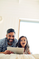 Image showing Portrait, digital tablet and daughter with father on a bed for reading, story and learning in their home together. Family, face and parent and girl relax in bedroom online with ebook or subscription