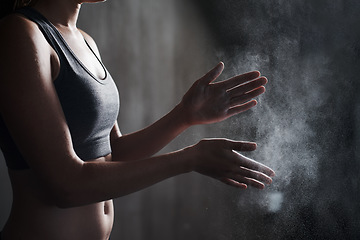 Image showing Fitness, woman and dust hands with chalk for intense workout, training or exercise at the gym. Hand of female personal trainer with powder for weightlifting, grip or preparation for exercising