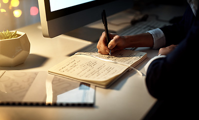 Image showing Hands, writing and notebook for working at night on creative ideas, strategy or schedule at a desk. Closeup of entrepreneur woman with pen and notes for planning, information or goals for a project