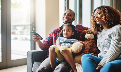 Image showing Love, smile and family on a couch, watching tv and bonding on a weekend break, home or chilling. Happy parents, mother or father with kid, female child or daughter on a sofa, happiness and television