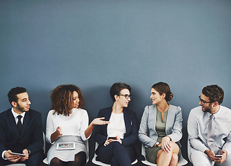 Image showing Business people, we are hiring and conversation before a job interview waiting and sitting in line. Communication, technology and staff with diversity and discussing for recruit meeting with mockup