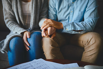 Image showing Holding hands, senior couple and life insurance support with paperwork in a living room. Home, anxiety and elderly people with empathy, stress and trust with solidarity for bills and tax problem
