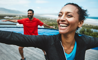 Image showing Fitness, wellness and couple doing outdoor yoga stretching together on a rooftop of a building. Happy, smile and young man and woman doing a pilates warm up exercise or workout for health in nature.