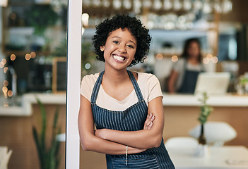 Image showing Happy woman, portrait and arms crossed at cafe in small business or waitress at entrance. Confident African female person, barista or restaurant smiling in confidence for management at coffee shop