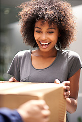 Image showing Happy customer, delivery and giving cardboard box while excited for courier service. African woman outdoor to collect a package from shipping, cargo or logistics worker with a smile at home