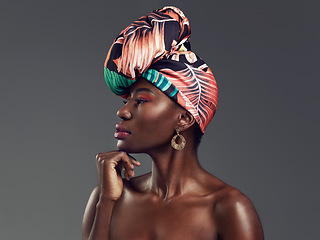 Image showing Makeup, turban and profile of a black woman in a studio with classy, elegant and traditional accessories. Beauty, cosmetic and young African female model with a head wrap isolated by gray background.